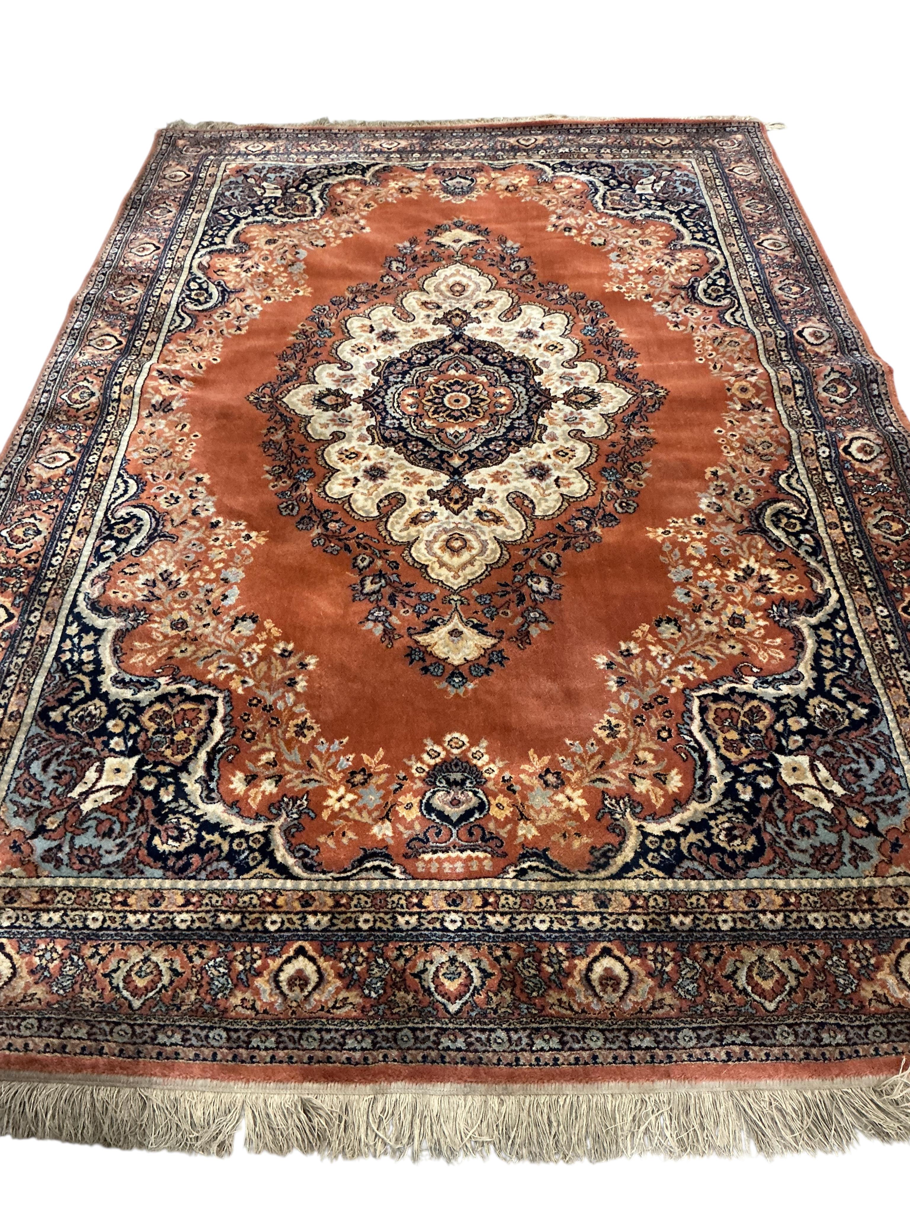 A Persian style machined blue ground carpet, 300 x 198cm